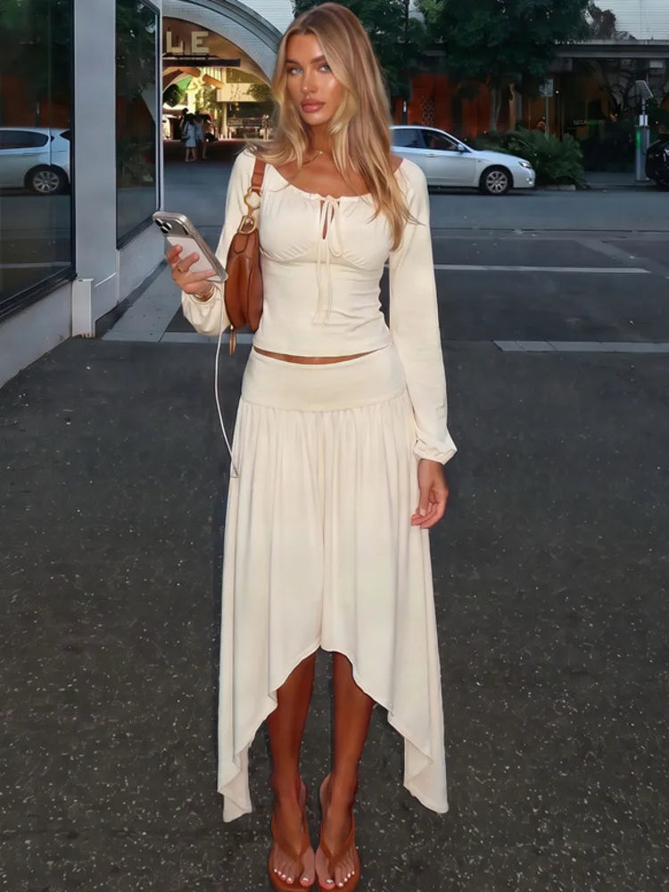 Cream off shoulder long sleeve crop top and asymmetrical hem midi skirt two-piece set