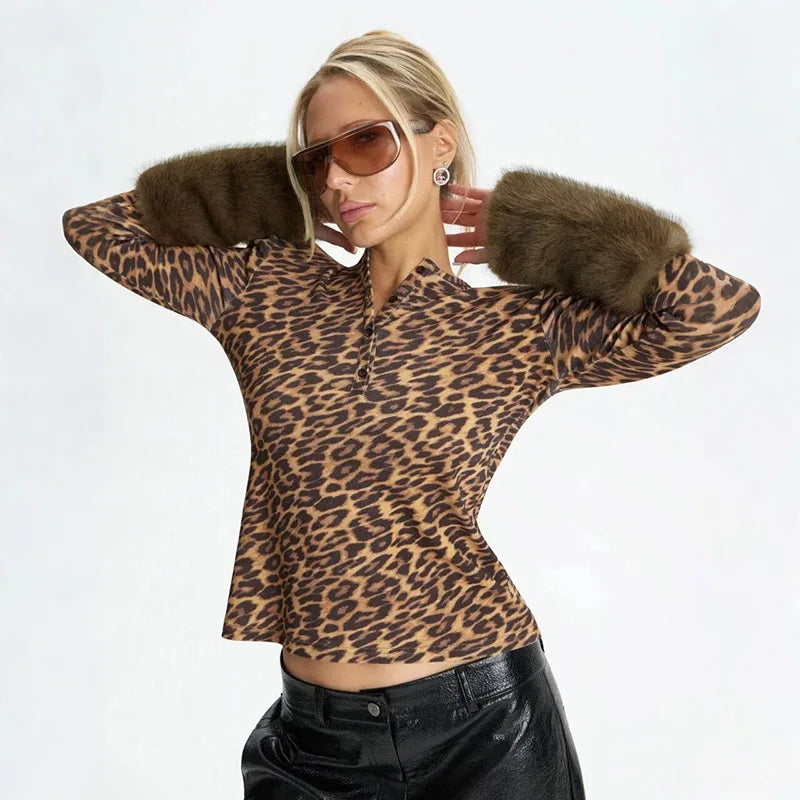 Model wearing a leopard print long sleeve top with fur trim and sunglasses