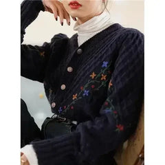 Embroidered floral detail on a knitted puff long sleeve cardigan.