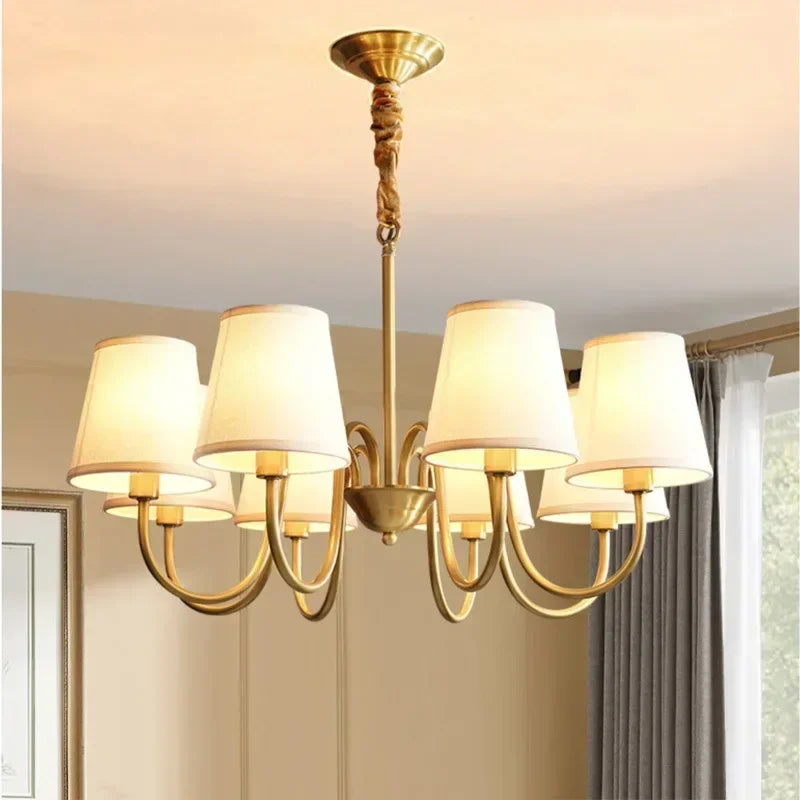 Classic 6-arm cottage chandelier with fabric shades and polished copper frame – warm lighting for dining and living spaces