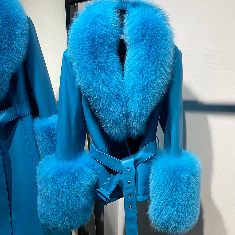 Blue coat with fur trim on a chair against a neutral background