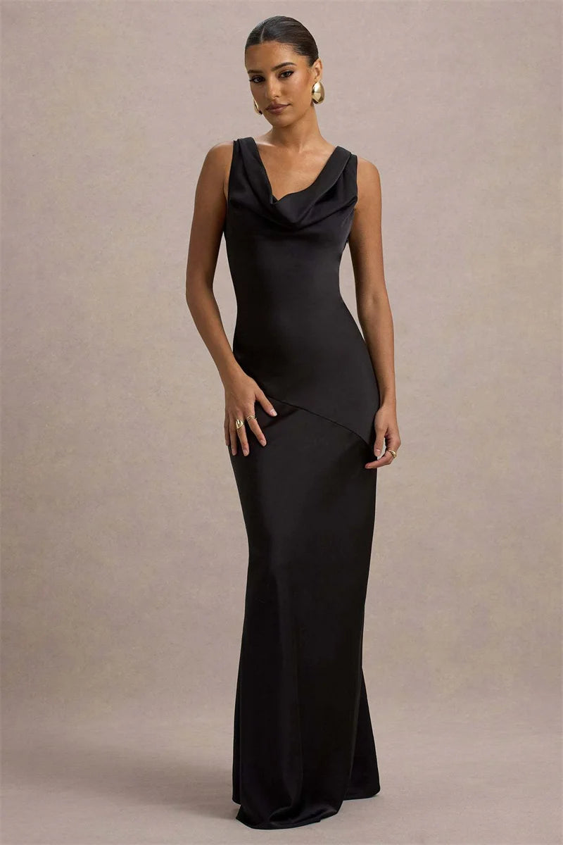 Woman wearing a black evening gown against a beige background