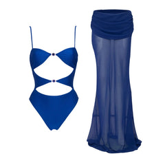 Blue bikini and sheer maxi skirt laid out flat.