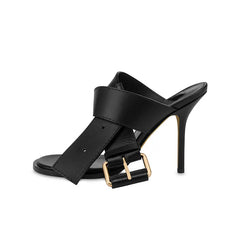 Side view of black buckle strap stiletto mule