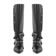 Front view of black pointed toe knee high boots with metal rivet and buckle details.