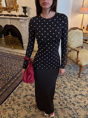 Model wearing black polka dot crew neck long sleeve maxi dress