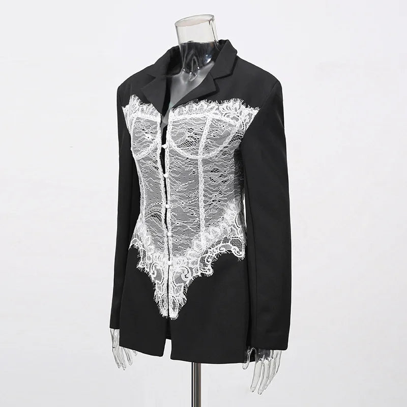 Black jacket with white lace detailing on a mannequin against a white background