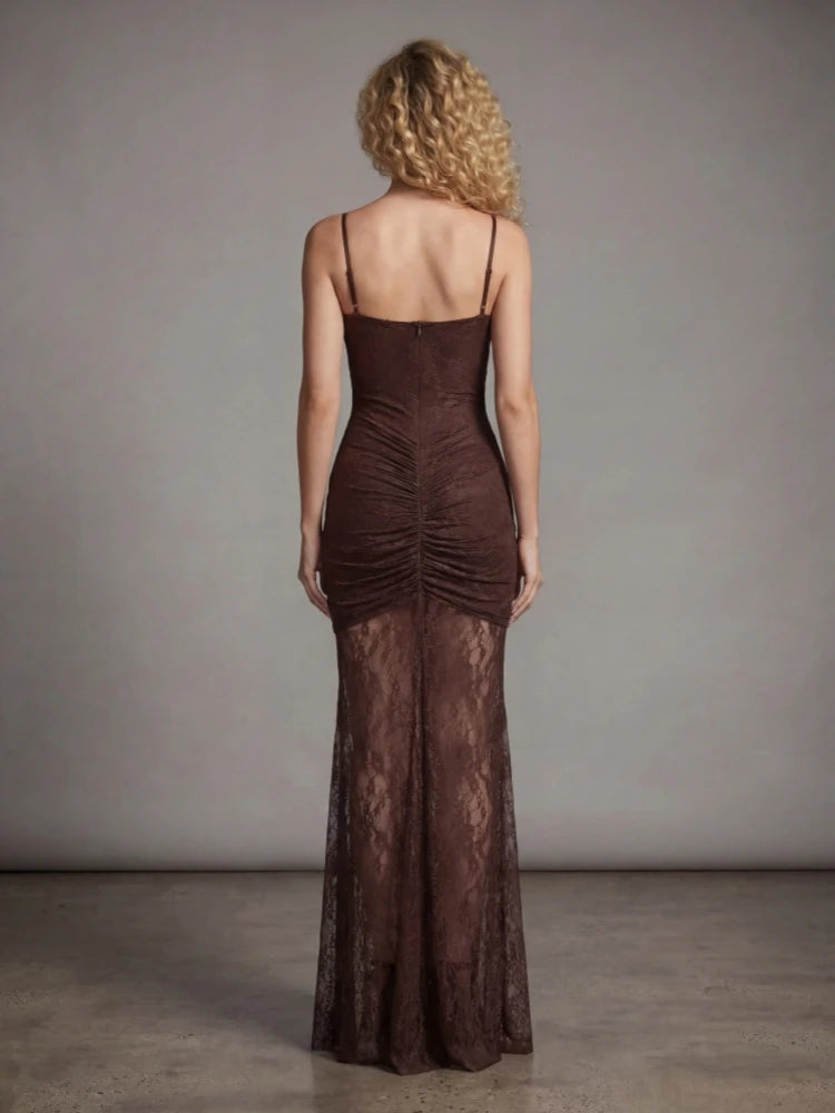 Woman wearing a brown evening gown with a plain background