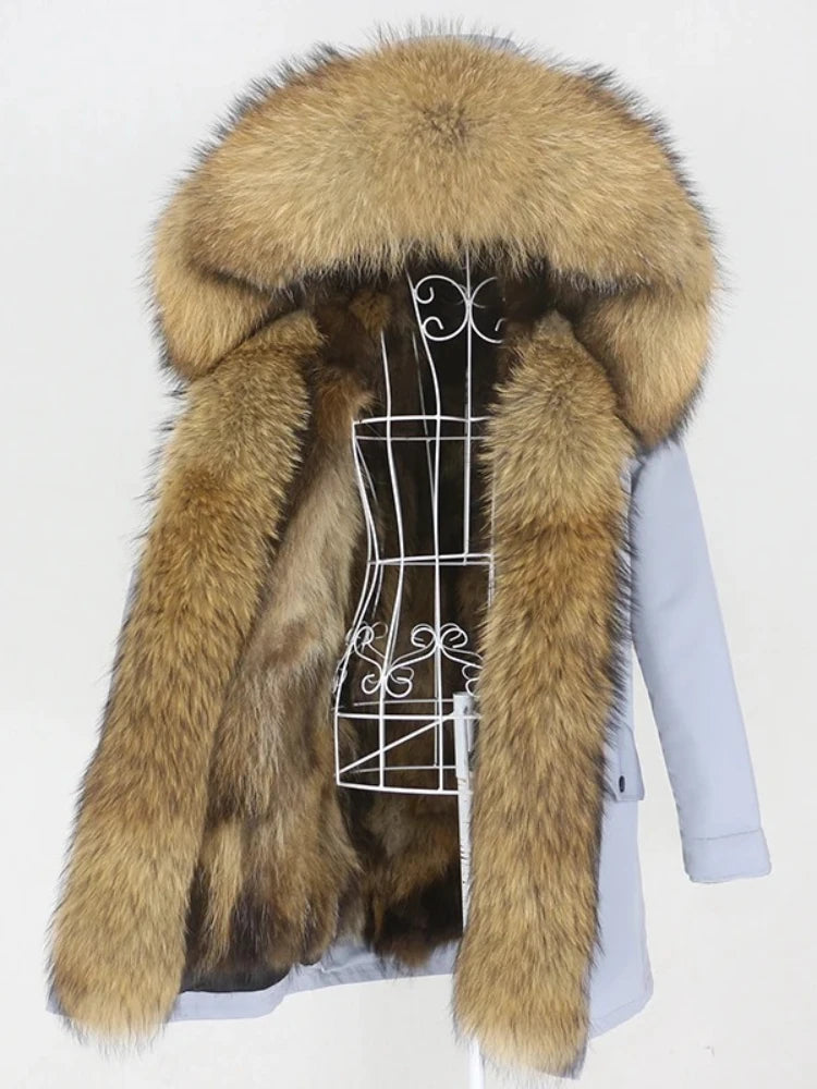 Fur coat with a hood on a mannequin against a white background