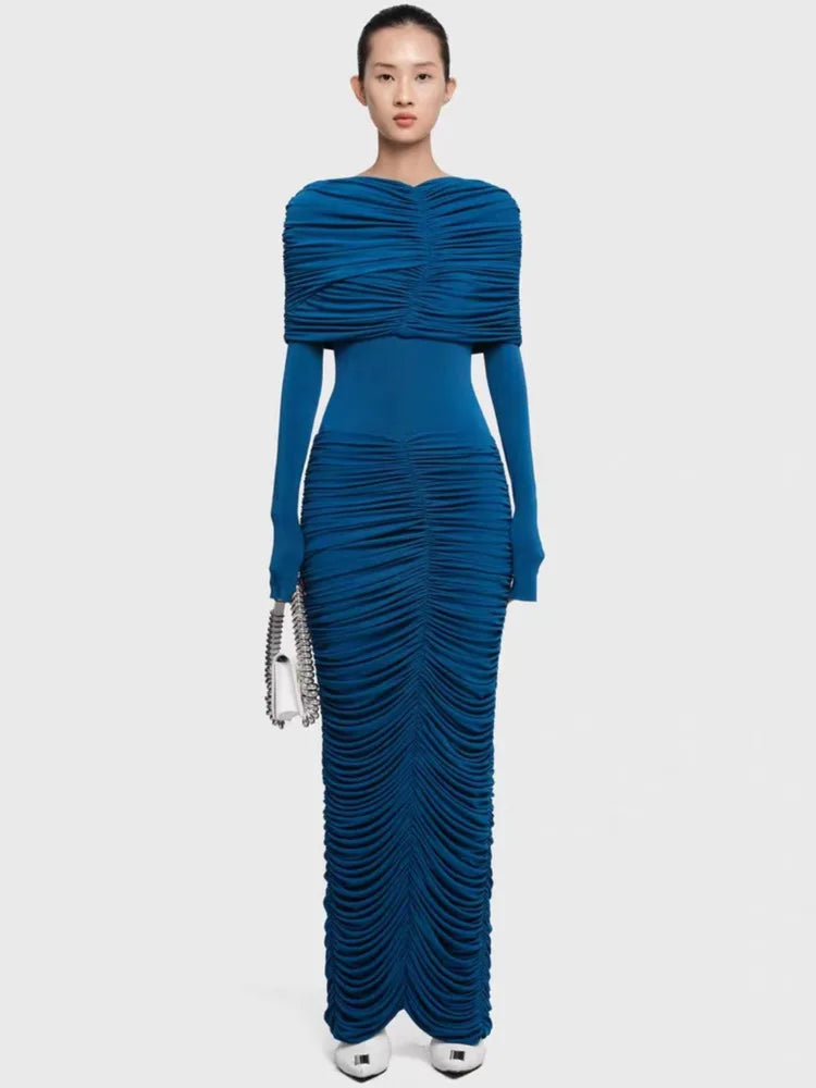 Woman wearing a blue evening gown on a white background