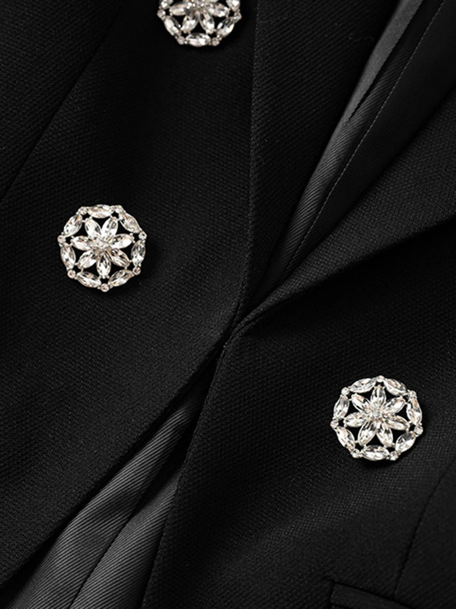 Close-up of a black jacket with silver floral buttons
