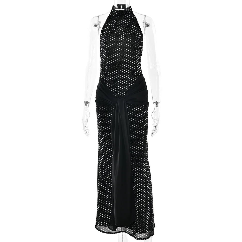 Black polka dot dress on a mannequin against a white background