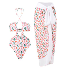 White floral printed one-piece swimsuit and matching sarong skirt.