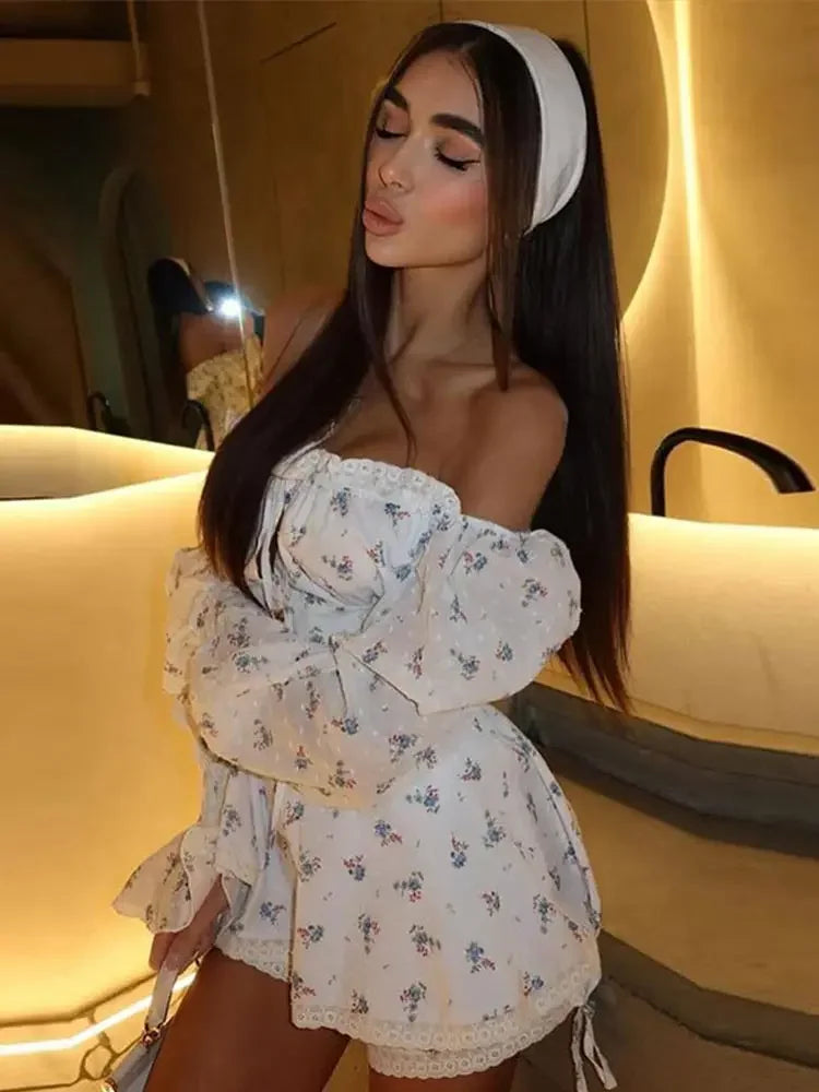 Woman wearing a white floral dress with a blurred background