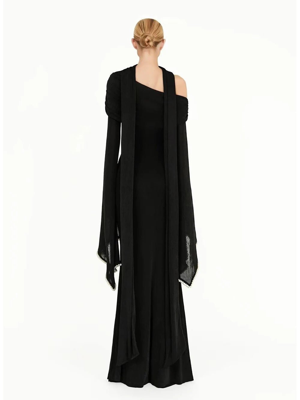Off shoulder trumpet sleeve beaded neck long black dress back view
