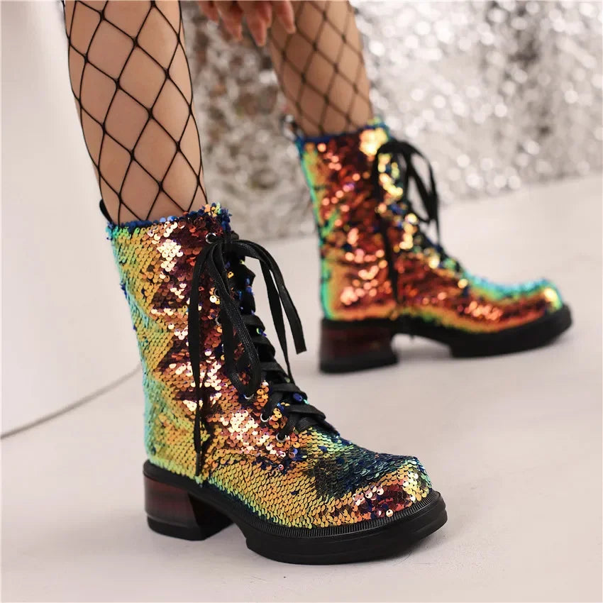 Multicolored sequin boots with fishnet stockings on a neutral background