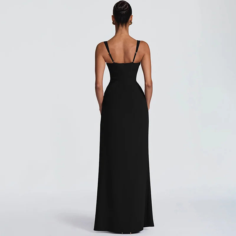 Black evening gown on a model against a light gray background