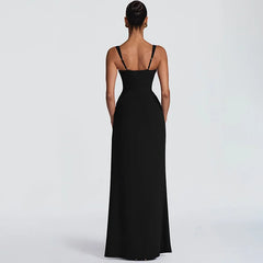 Black evening gown on a model against a light gray background