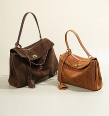 
A Deep Brown handbag and A light Brown Handbag with a gold clasp on a white background
