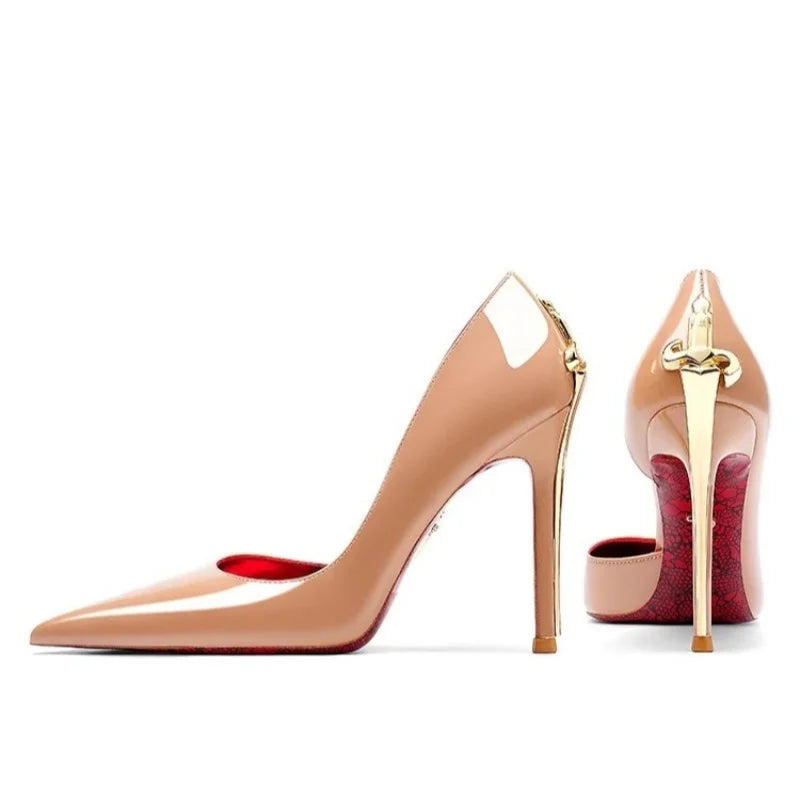Pair of high-heeled shoes with red soles and gold accents on a white background