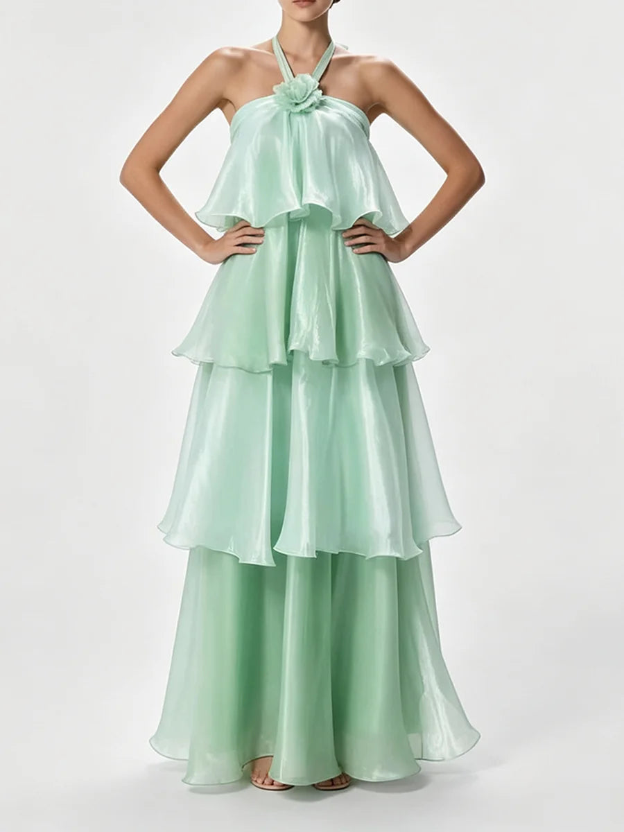 Halter neck tiered maxi dress with hands on hips