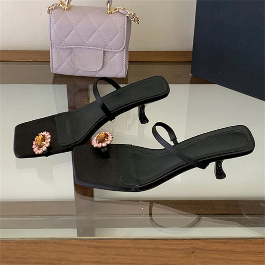 Black crystal embellished square toe flip flops