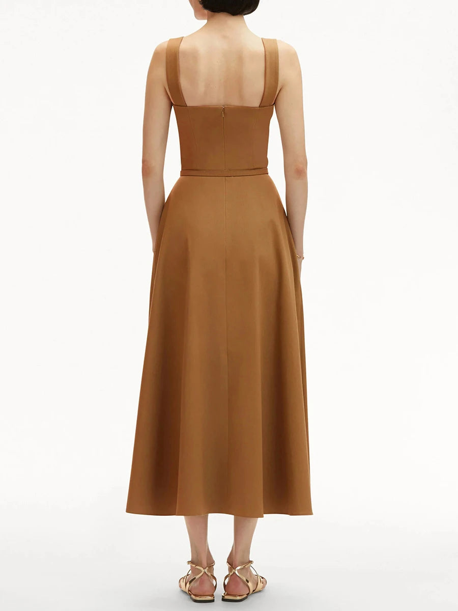 Brown dress worn by a model on a white background