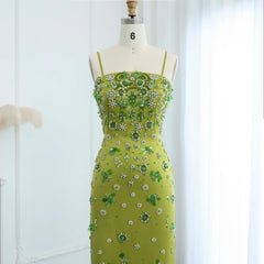  Mannequin displaying the green floral beaded midi dress, showcasing its elegant silhouette and feminine charm. Golden Atelier 3