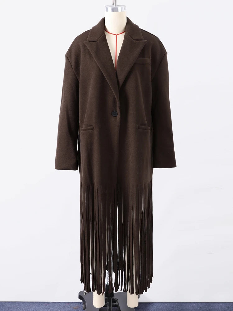 Brown coat with fringe details on a mannequin against a white background