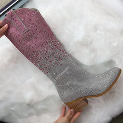 Pink and silver glittery boot on a white fur surface