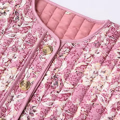 Close-up of floral quilted puffer jacket buttons and neckline