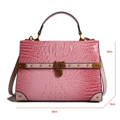 Pink crocodile embossed bag with dimensions labeled