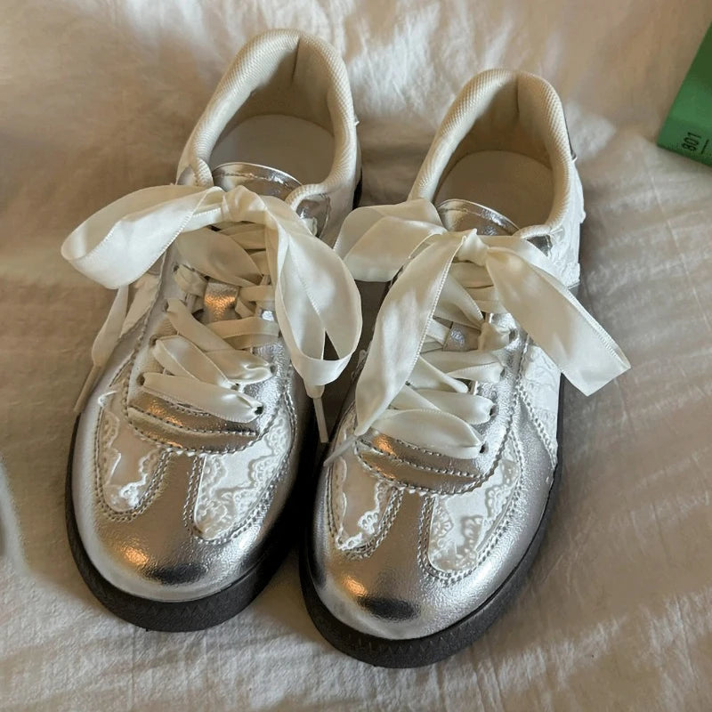 Silver lace-up ballet flats with ribbon ties