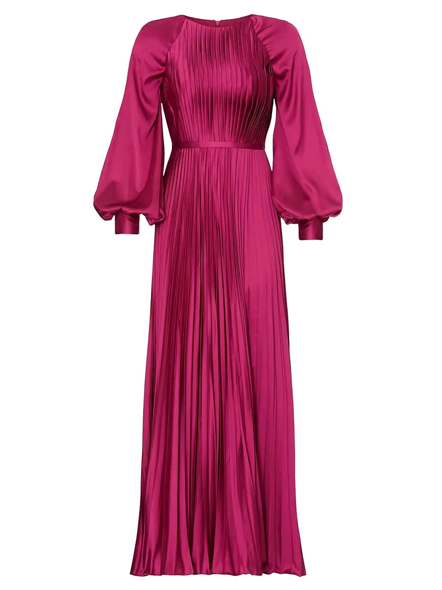 Fuchsia pleated dress with puff sleeves on a white background