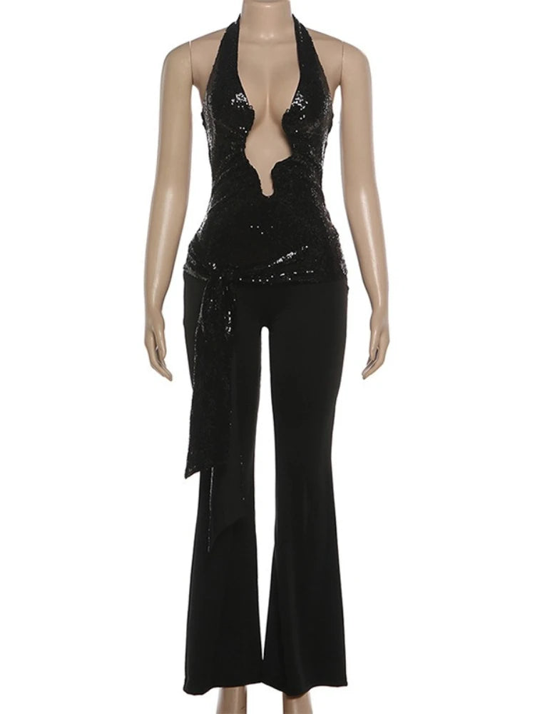 Black sequin jumpsuit on a mannequin against a white background