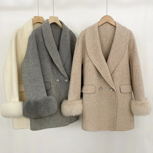Collection of wool coats in oatmeal, grey, and beige with fur cuffs