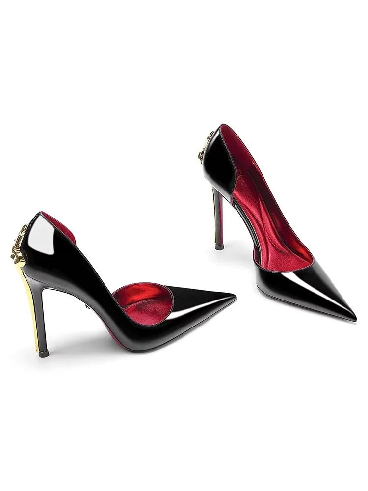 Black high-heeled shoes with red interior on a white background