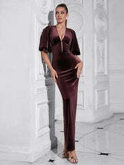 Women's maxi dress with puff sleeves and an open back.