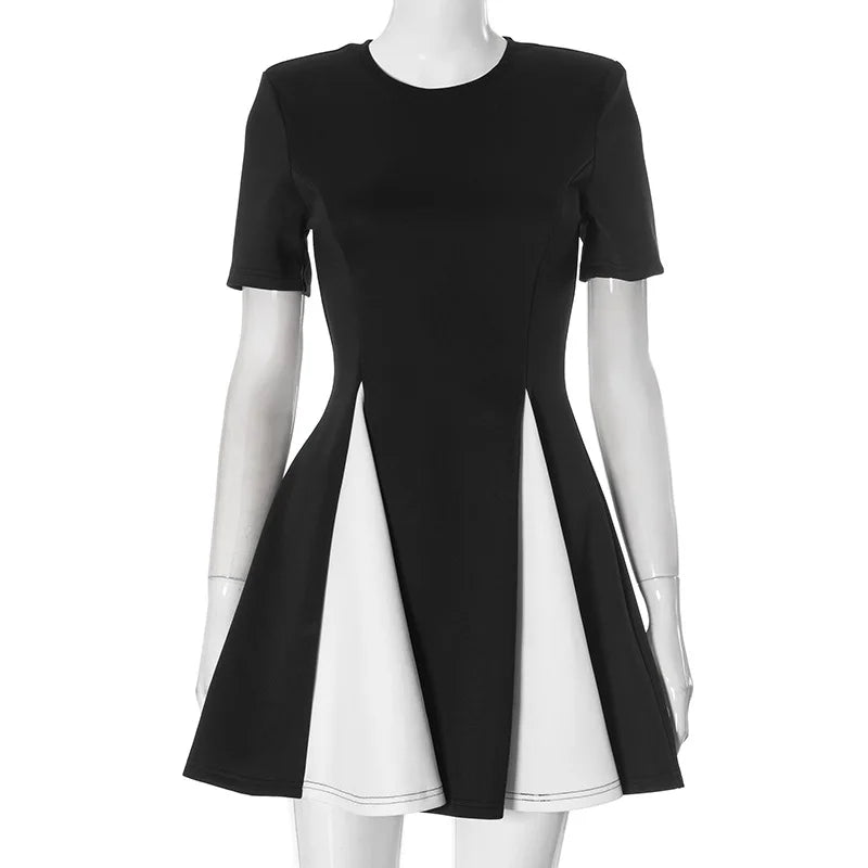 Black and white dress on a mannequin against a white background