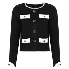 Black knit cardigan with jeweled buttons and contrasting trim