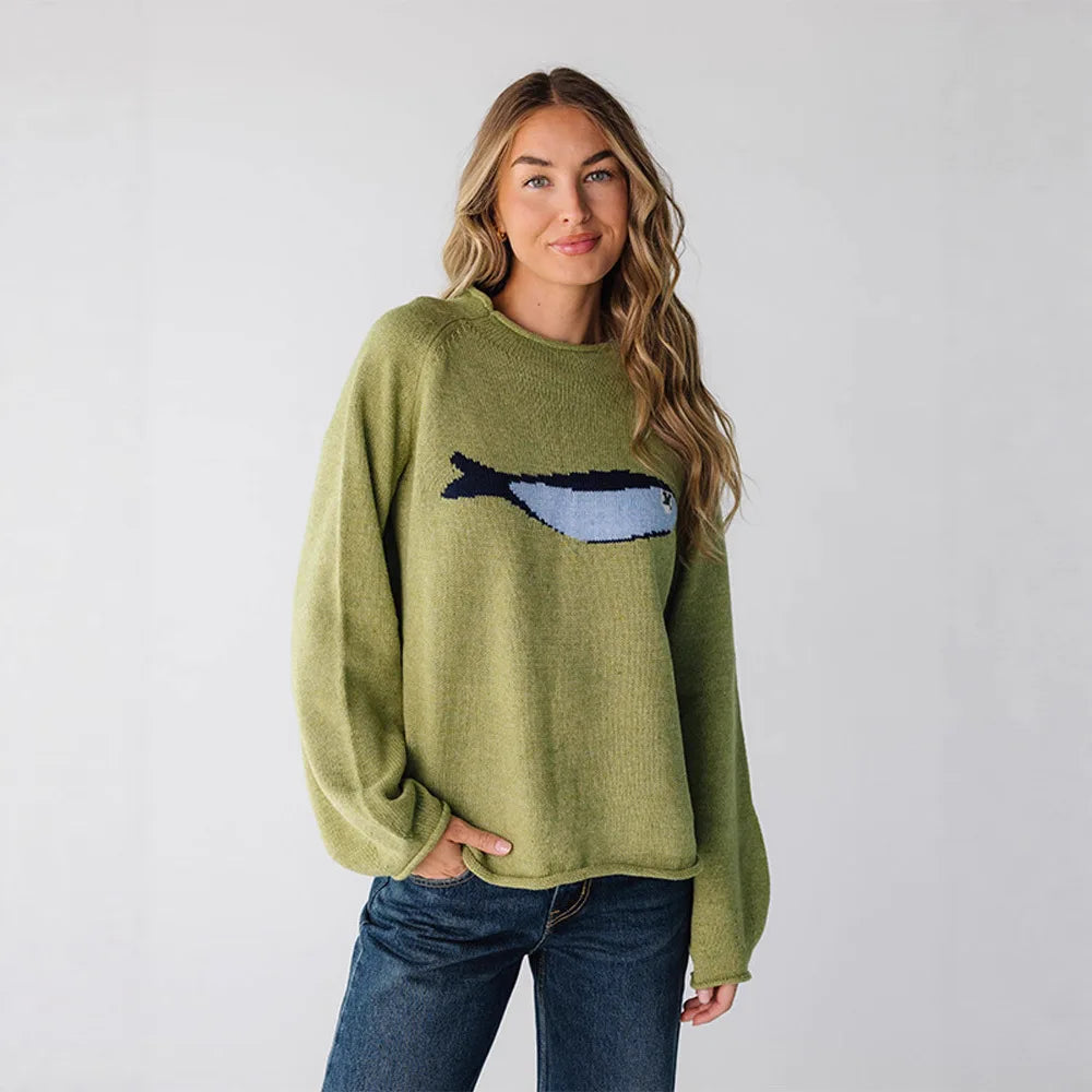 Model wearing green crew neck knit sweater with fish graphic print