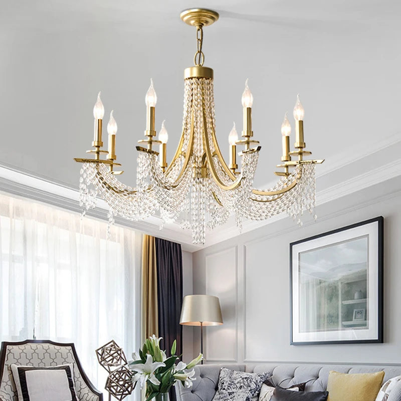 A luxurious living room illuminated by a romantic crystal chandelier, creating an inviting atmosphere. A