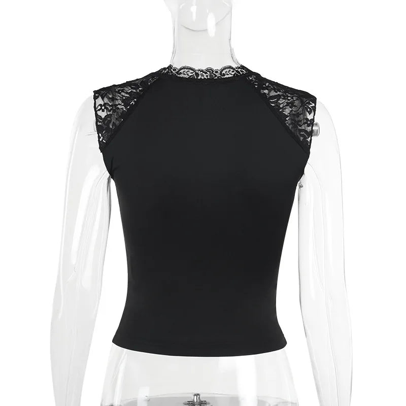 Black top with lace detailing on a mannequin against a white background