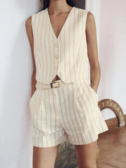 A model wearing a stylish striped vest and shorts set, perfect for summer. Golden Atelier 1