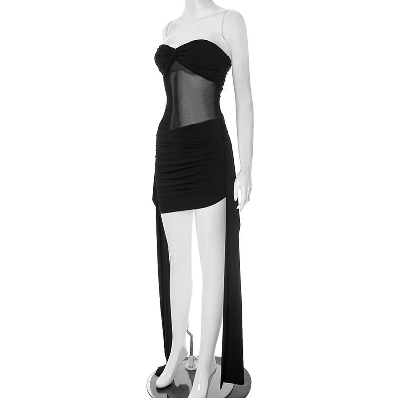 Black dress with sheer overlay on a mannequin against a white background