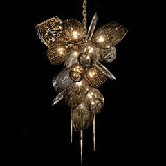 Decorative chandelier with gold and silver finish on a black background