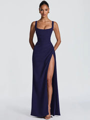 Navy blue evening gown with a high slit on a white background
