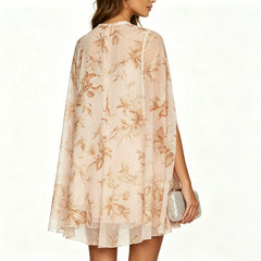 Back view of a floral print cape sleeve mini dress