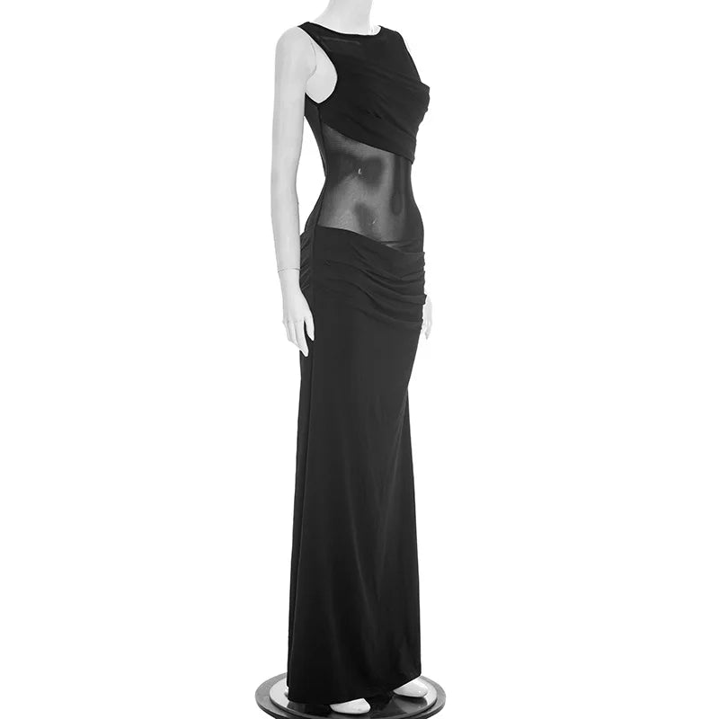 Black evening gown on a mannequin against a white background