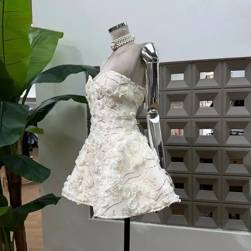 Side view of white 3D floral strapless mini dress
